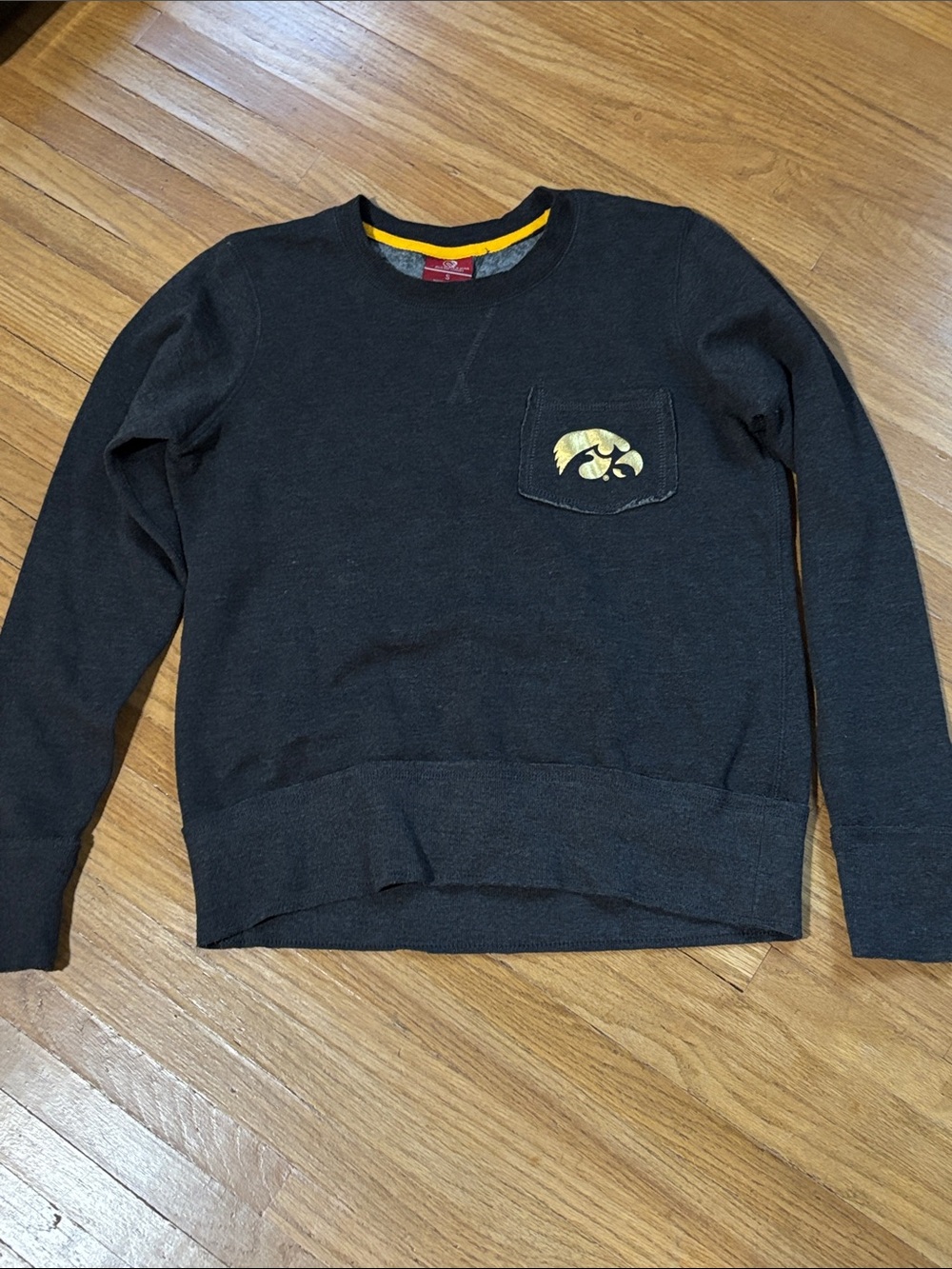 Colosseum Black Crewneck Sweatshirt with Yellow Iowa Hawkeyes Pocket Logo